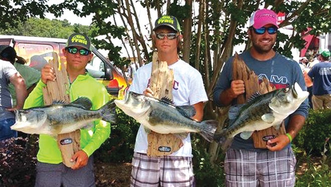 Three Central Louisiana anglers were among the 139 fishermen to receive a bass fiberglass replica May 22 from the Toledo Bend Lunker Program. The three anglers are (from left) Colby Miller of Elmer, Wes Holt of Otis and Zack Gagnard of Pineville. The three friends picked up their replicas during the final day of the 30th annual Sealy Big Bass Splash at Cypress Bend.