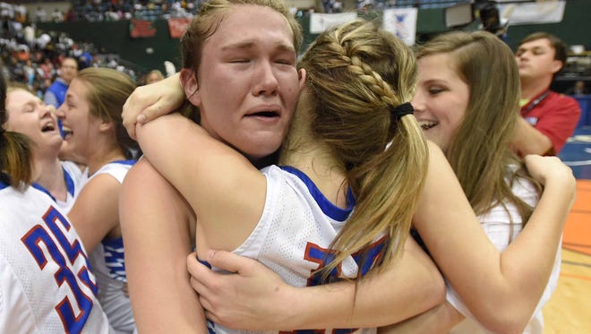 Mallory Russell and the Ingomar Lady Falcons celebrate after beating Heidelberg 41-40 in the Class 2A championship on Friday at Mississippi Coliseum.