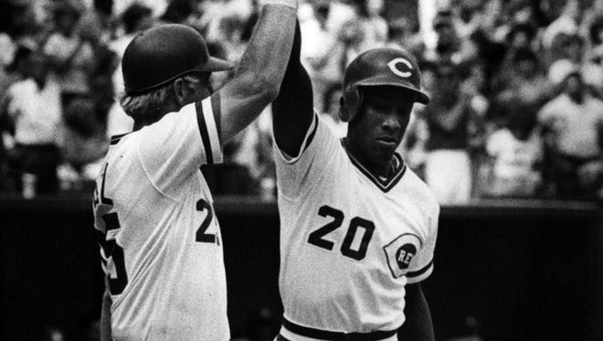 Buddy Bell (left) congratulates Eddie Milner for a hit that brought in three runs in September of 1986.