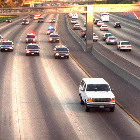 White Ford Bronco driven by Al "A.C." Cowlings and