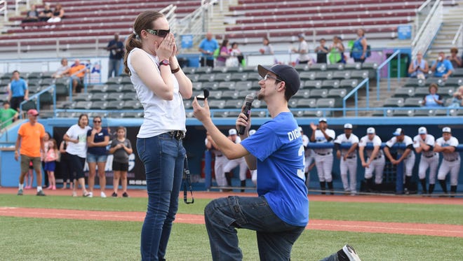 Anthony DiGiannantonio proposes to Sarah Ringwood, both from Poughquag, after DiGiannantonio threw a first pitch prior to the start of Thursday’s New York-Penn League playoff game between the Hudson Valley Renegades and Lowell Spinners at Dutchess Stadium.