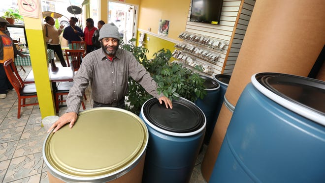 Caribreeze owner Dave King sells shipping barrels at his Spring Valley restaurant Nov. 18, 2015. Jamaicans and Haitian-Americans traditionally ship barrels full of goods overseas to family members at Thanksgiving.