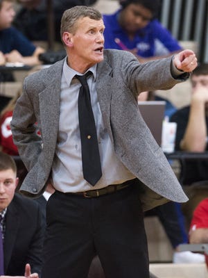 Ben Davis High School head coach Mark James directs the players on the court in the final minutes of the game during the second half of action. Southport High School hosted two semi-final games of the 2015 Marion County Boys Basketball Tournament, Friday, Jan. 16, 2015. Ben Davis defeated Warren Central 55-43 to advance to the championship game.