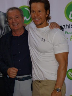 Birmingham Bella Piatti owner and Wahlburgers managing partner Nino Cutraro greeted fans on the red carpet with Wahlburgers founder and movie star Mark Wahlberg.