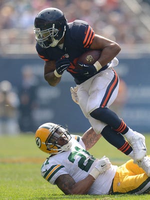 Packers safety Ha Ha Clinton-Dix tries to bring down Bears running back Matt Forte in the second quarter of a 2014 game in Chicago.