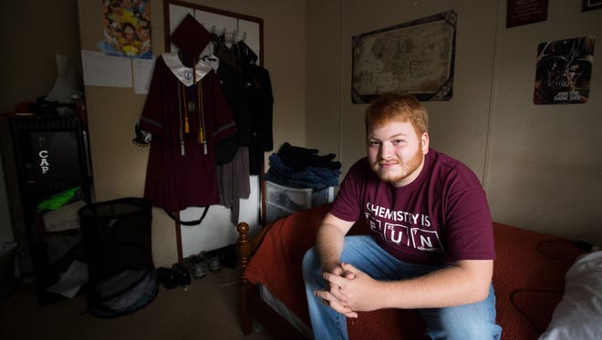James Paul Driver, a recent graduate from Westside High School, is pictured in his bedroom in Anderson on Thursday, May 25, 2017. Driver, who was adopted by his great aunt after being neglected as an infant, grew up in the mobile home with eight others. 
