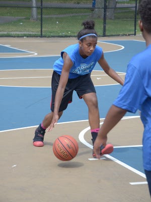 Brazyll Watkins plays at Claude Evans Park as part of Cereal City Hoopsters Summer League play on July 7.