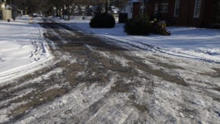 A residential street in Jackson is passable, but remains icy.
