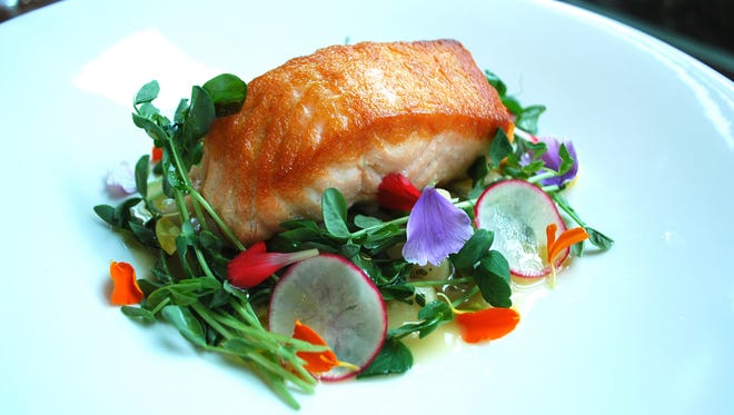 Prima: Salmon over baby gnocchi, smoked kale, fennel, radish and edible flowers.
