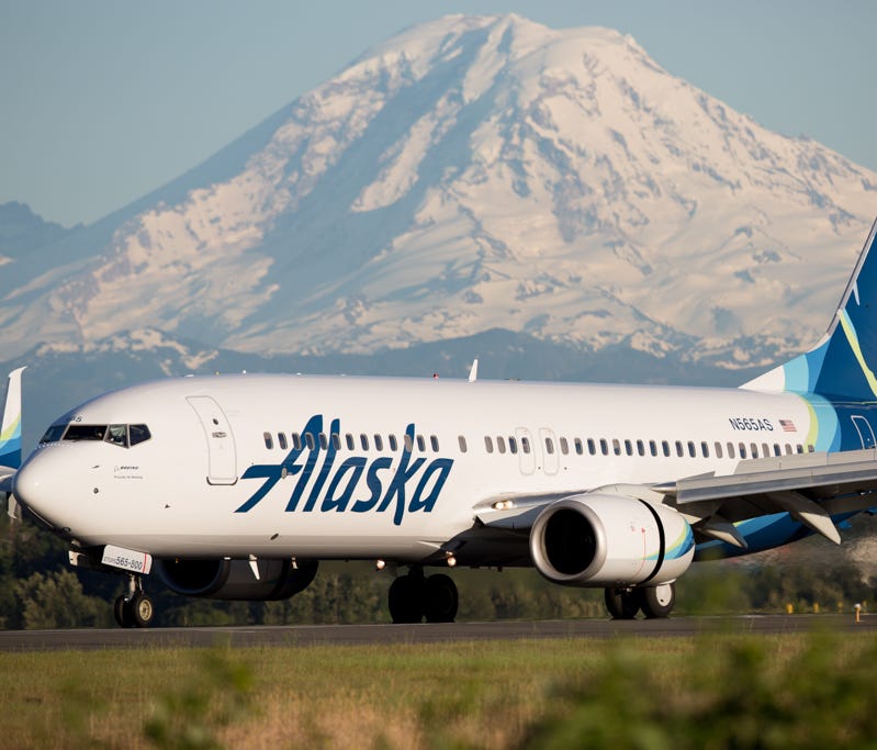 Sporting the airline's recently updated livery, an Alaska Airlines Boeing 737 lands at Seattle-Tacoma International Airport in May 2016.