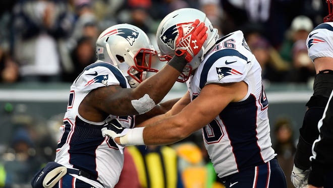 Running back Jonas Gray #35 celebrates a fourth quarter touchdown with fullback James Develin #46 of the New England Patriots against the New York Jets during a game at MetLife Stadium on Dec. 21, 2014 in East Rutherford, N.J.