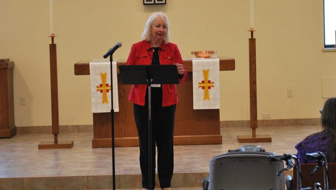 Karen Lueders, who had a highly publicized struggle with mental illness, speaks at a Community Mental Health Rally that she organized on May 5 at Calvary Evangelical Lutheran Church in Sheboygan.
