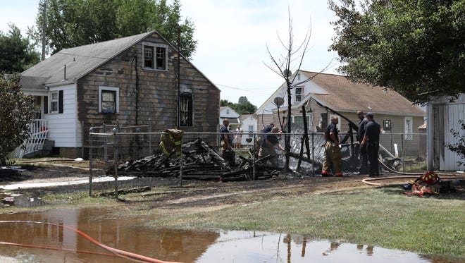 Fire damaged three houses and destroyed a garage on Fess Street in Zanesville Thursday afternoon.