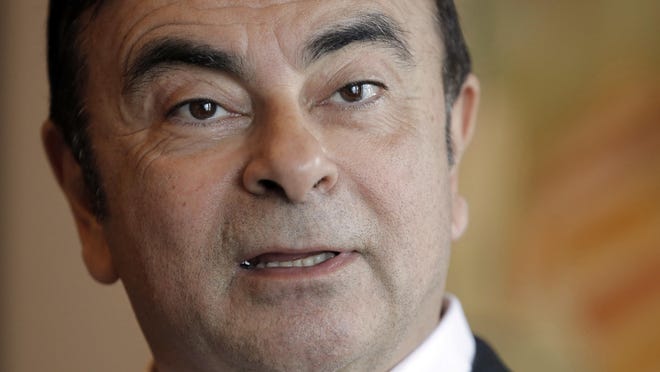 Carlos Ghosn  was arrested Monday and will be fired for allegedly underreporting his income and misusing company funds, the automaker said. (AP file/Kin Cheu)