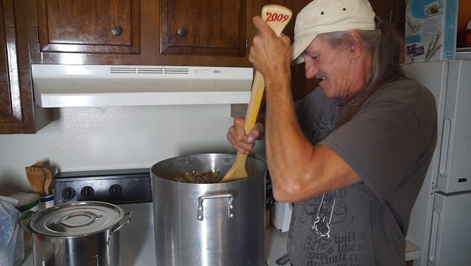 Miguel used to be homeless, so he knows how far the stew he is making will go for his still-homeless friends.