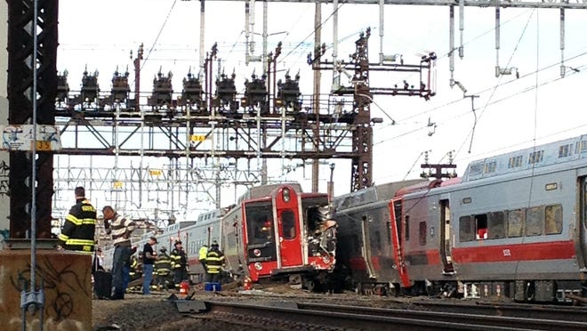 Emergency workers responding to the May 2013 Metro-North Railroad train derailment and collision in Connecticut.