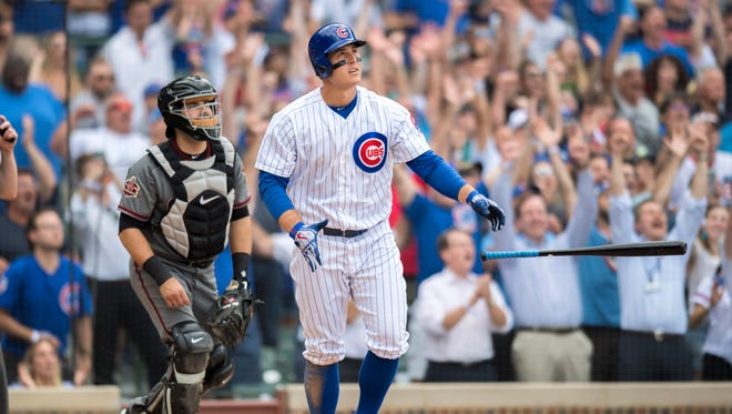 Jul 26, 2018: Chicago Cubs first baseman Anthony Rizzo (44) hits a home run during the ninth inning against the Arizona Diamondbacks at Wrigley Field.