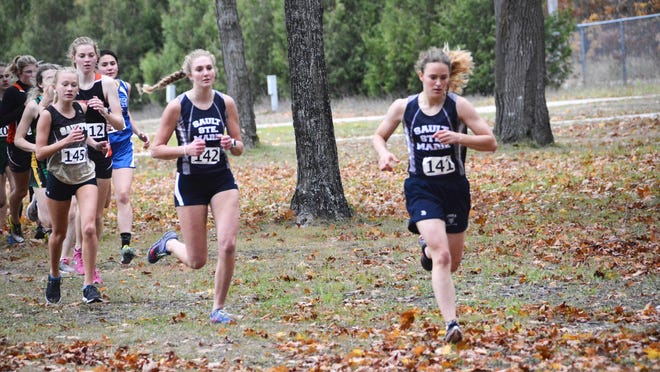Sault High's Anna Hildebrand (141) and Haleigh Knowles (142), and Wisteria Brady of St. Ignace (145) were the early race leaders at the SAC 3 cross country race in Kinross Monday. The Blue Devils won girls and boys' conference titles.