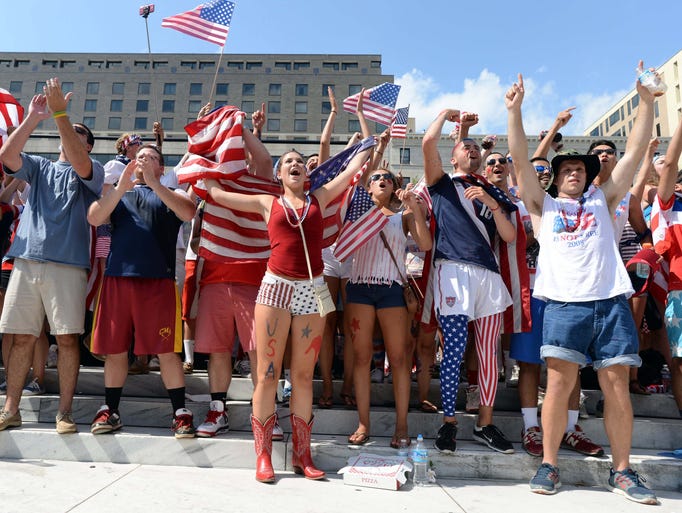 Soccer fans react during a viewing party for the USA versus Belgium World Cup Soccer match on Freedom Plaza.
