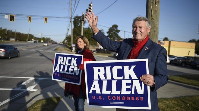 Congressman Rick Allen and his wife, Robin, campaign along Washington Road in Evans, Ga., on Nov. 3, 2020. Columbia County would no longer be split between two congressional districts under a proposed redistricting map.