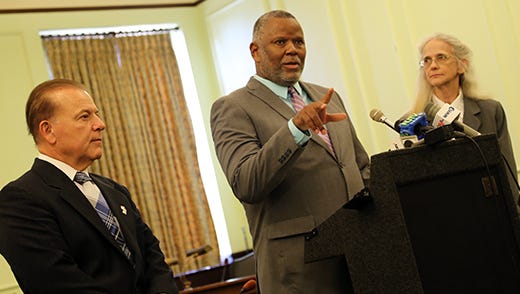 Sen. Joseph Pennacchio, left, watches as A.J. Nash, exonerated after 17 years in prison for a crime he did not commit, speaks at a Statehouse press conference in Trenton on Oct. 5, 2017.