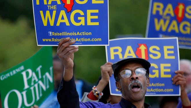 Supporters of raising the minimum wage rally in Peoria, Ill., on Oct. 9.