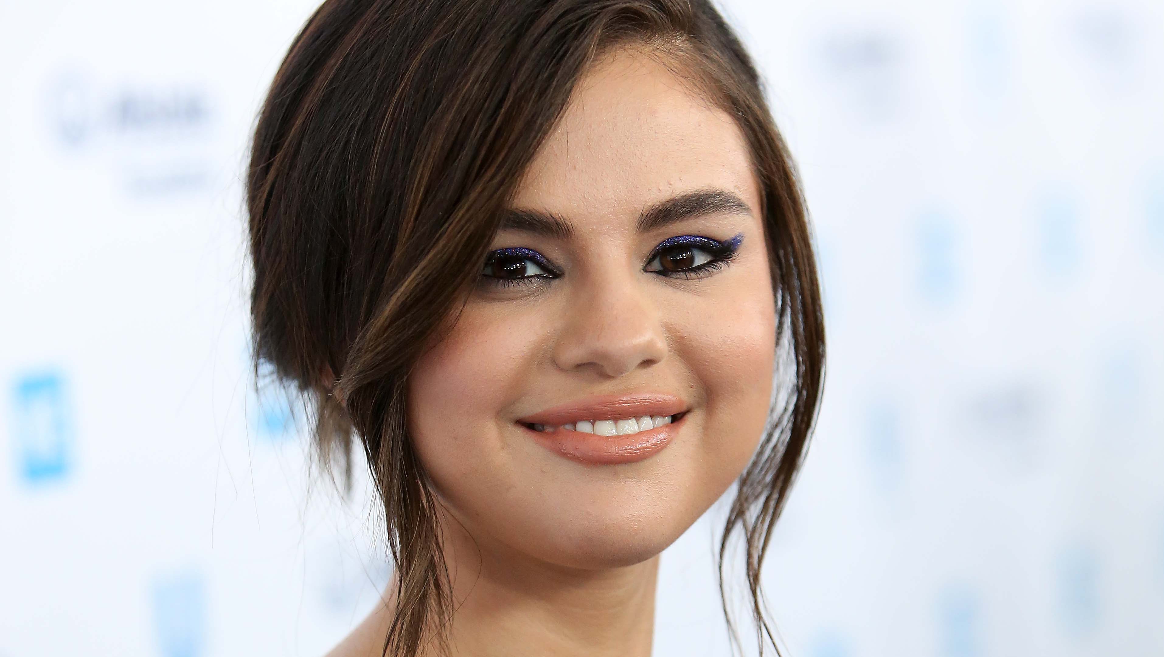 Selena Gomez bikini designs covers kidney transplant scar