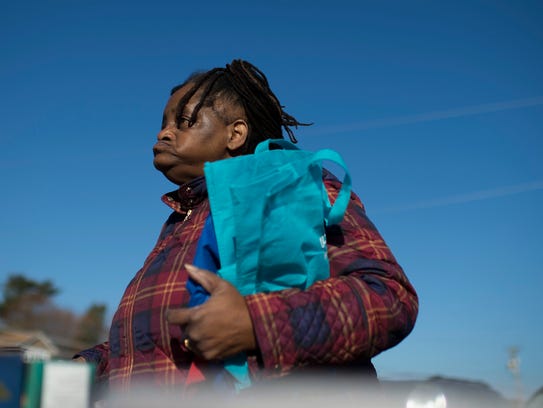 Renee Finney of Glassboro gets her bags ready to fill