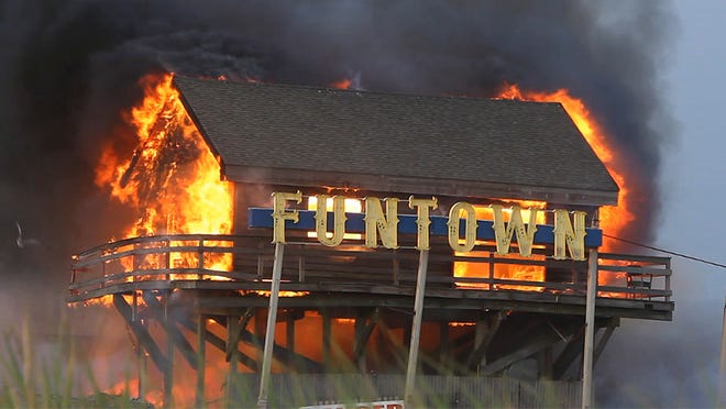 The owner of the Funtown Pier wants to build giant rides at the Seaside Park amusement area. The Funtown Pier is engulfed in flames at the southern end of the boardwalk in Seaside Park on Sept. 12, 2013.