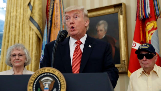 President Trump, with a portrait of President Andrew Jackson, in July 2017.