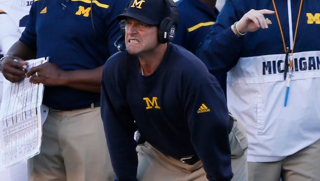 Michigan coach Jim Harbaugh on the sidelines in the first quarter of the loss to Utah Thursday in Salt Lake City.