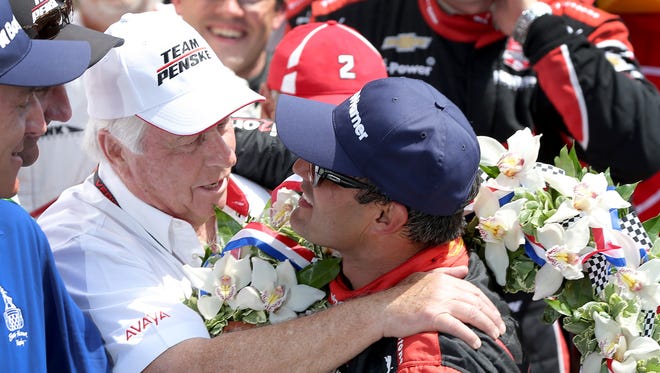 Juan Pablo Montoya (right) gave Roger Penske his record-extending 16th Indianapolis 500 victory in May.