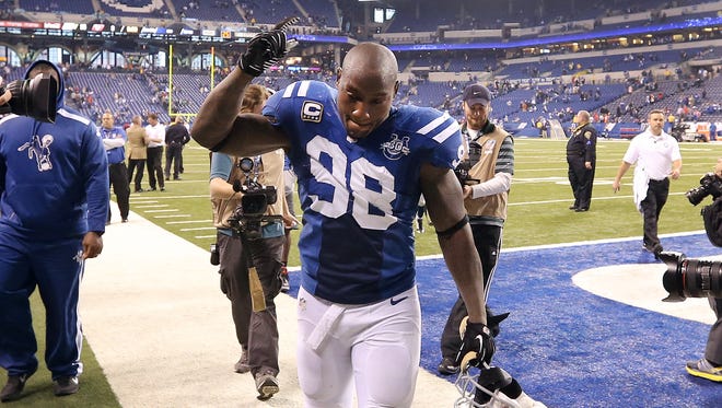 Indianapolis Colts Robert Mathis runs off the field following their win. The Indianapolis Colts defeated the Houston Texans 25-3 in their NFL football game Sunday, December 15, 2013, afternoon at Lucas Oil Stadium.