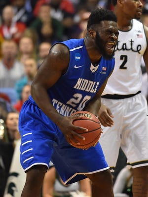 Middle Tennessee Blue Raiders guard Giddy Potts (20) reacts during the second half against the Michigan State Spartans of the first round in the 2016 NCAA Tournament at Scottrade Center.
