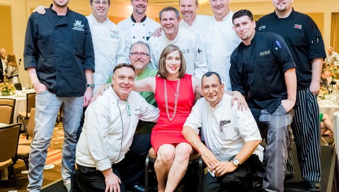 Karen Pendleton surrounded by participating chefs
