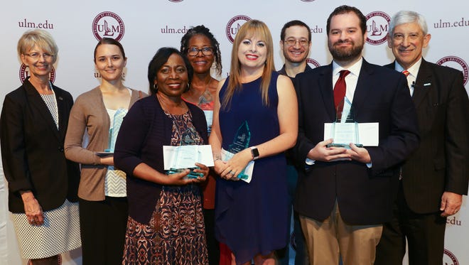 Six faculty and staff at the University of Louisiana Monroe were recognized Thursday with the prestigious ULM Foundation Award. Presenting the awards were Foundation Executive Director Susan Chappell, left, and ULM President Nick J. Bruno, right. Winners were, from left, front, Andria Price, Kelli Cole and Dr. Matthew E. Talbert and in back, Chappell, Karen Witek accepting for her husband, Aaron J. Witek, Pamela Higgins Saulsberry, James Boldin and Bruno.