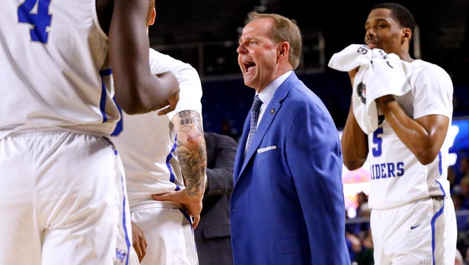 MTSU’s head coach Kermit Davis yells at his team as they come to the sidelines for a timeout during the game against Vermont on Tuesday, March 13, 2018, at MTSU during the first round of the NIT. 