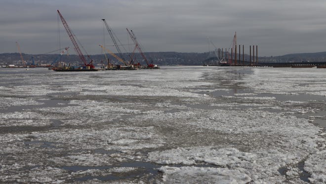 Cranes work on the new Tappan Zee Bridge as ice forms in the Hudson River on Jan. 14.