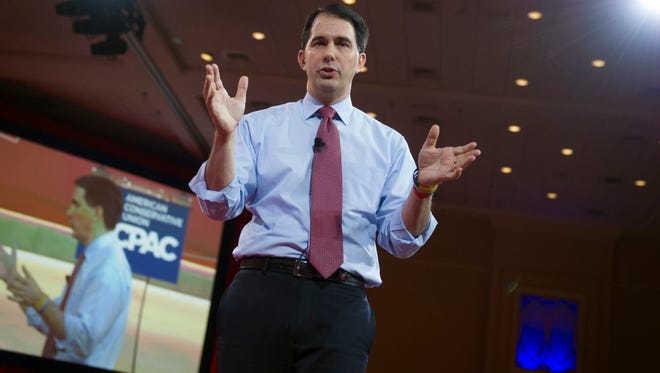 Wisconsin Gov. Scott Walker gestures while speaking during the Conservative Political Action Conference in National Harbor, Md., last month.