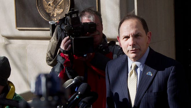 FILE - In this Feb. 24, 2015 file photo, Veteran Affairs Secretary Robert McDonald speaks to reporters outside VA Headquarters in Washington. More than one-third of calls to a suicide hotline for troubled veterans are not being answered by front-line staffers because of poor work habits and other problems at the Department of Veterans Affairs.