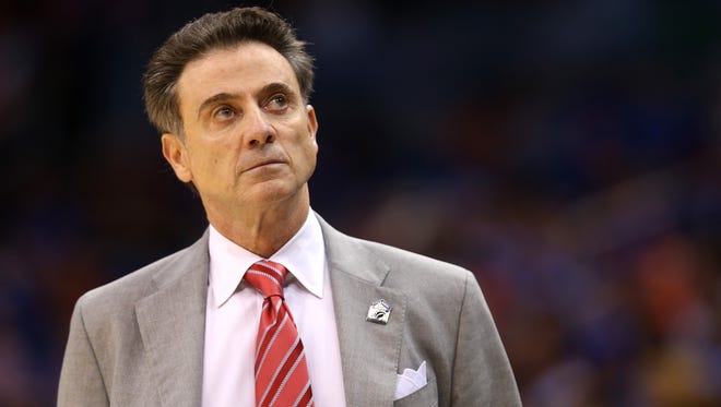 Head coach Rick Pitino of the Louisville Cardinals looks on in the first half while taking on the Saint Louis Billikens during the third round of the 2014 NCAA Men's Basketball Tournament at Amway Center on March 22, 2014 in Orlando, Florida.