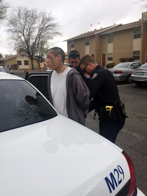 This photo provided by the Albuquerque Police Department shows Lionel Clah being taken into custody by Albuquerque police Saturday. Clah was the second of two New Mexico convicts who escaped from a fortified prison transport van Wednesday.