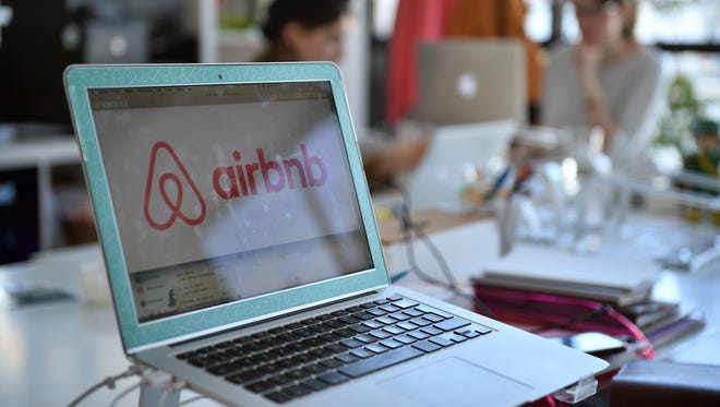 A picture shows the logo of online lodging service Airbnb displayed on a computer screen in the Airbnb offices in Paris on April 21, 2015.