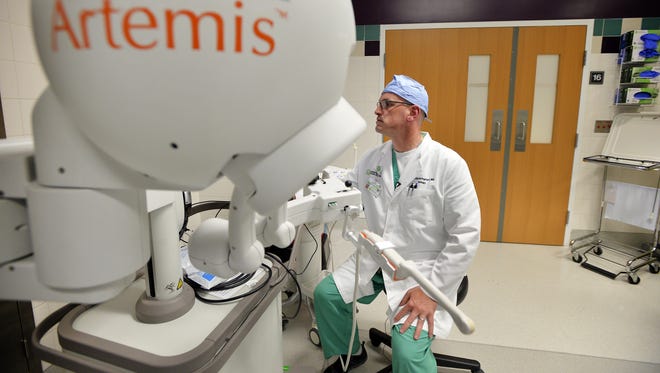 Greenville Health System physician Dr. Patrick Springhart reviews patient history on an Artemis machine on Tuesday, August 18, 2015. Artemis allows doctors to more precisely map prostate cancer.