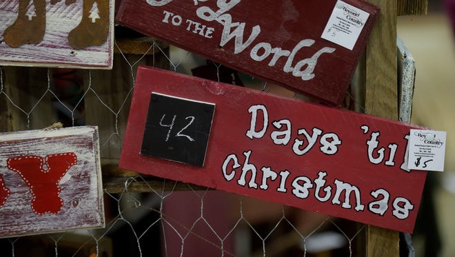A sign counts down the days until Christmas at an area craft show.