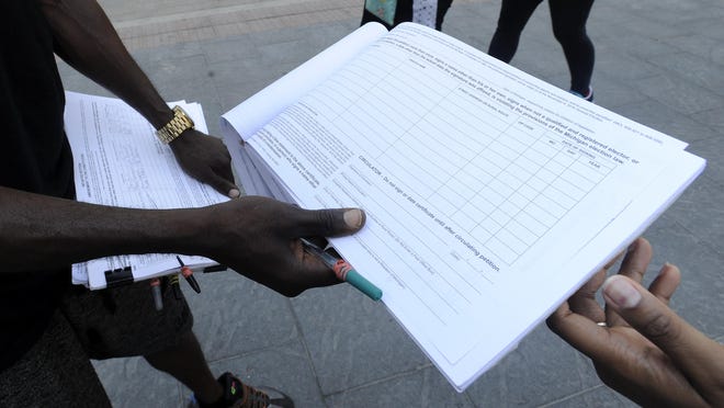 Michigan Gov. Rick Snyder will decide the fate of a GOP proposal to toughen petition drive rules.
