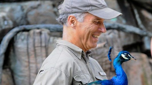 Director of the Cincinnati Zoo & Botanical Garden Thane Maynard makes an impromptu appearance with a peacock