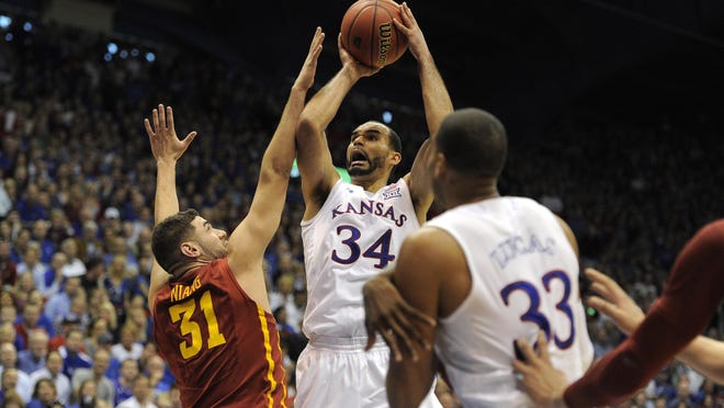 Kansas forward Perry Ellis drives to the basket against Iowa State Cyclones forward Georges Niang on March 5 in Lawrence, Kan. Ellis has averaged 16.7 points per game to lead the Jayhawks this season.