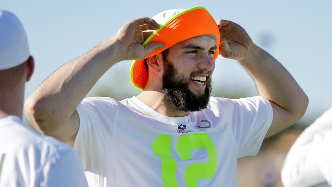 Indianapolis Colts quarterback Andrew Luck talks with teammates during practice for the NFL Football Pro Bowl Saturday, Jan. 24, 2015, in Scottsdale, Ariz. The game is scheduled to be played Sunday in Phoenix. (AP Photo/Mark Humphrey)