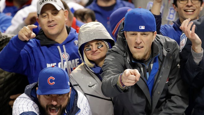 Chicago Cubs fans celebrate at Progressive Field after Game 2 of the Major League Baseball World Series against the Cleveland Indians Wednesday, Oct. 26, 2016, in Cleveland. The Cubs won 5-1 to tie the series 1-1. (AP Photo/David J. Phillip) ORG XMIT: WS149